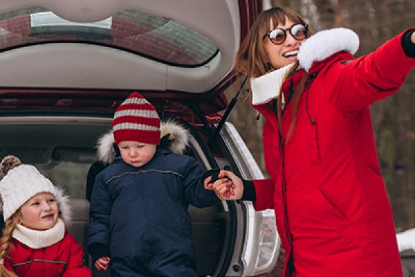 Family in the car at Christmas